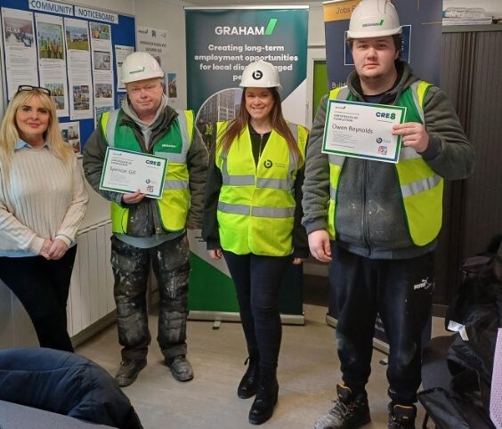 Pam Green, GRAHAM’s Social Impact Business Partner, and Joanne Fisher, Associate Director at Building Careers UK, pictured with the CRE8 delegates holding their certificates after completing the programme